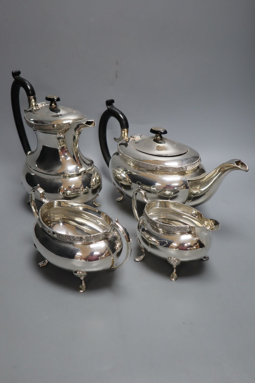 A silver plated four piece tea and coffee service, hot water jug 21cm